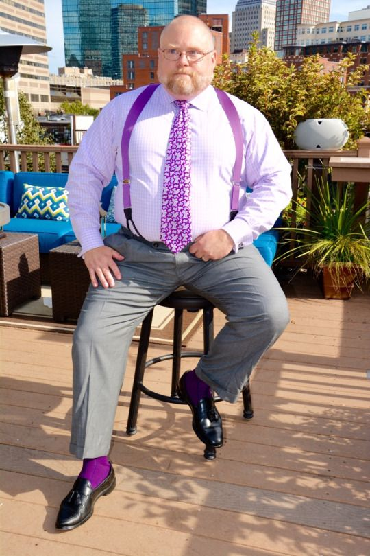Fat man wearing purple color suspenders